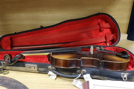 A Rosetti violin bearing faux Stradivarius label, cased with bow